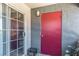 Exterior view of a sliding glass door and a red front door at 8600 W Charleston Blvd # 2190, Las Vegas, NV 89117