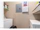 Laundry area with a side by side washer and dryer and some storage shelves at 8600 W Charleston Blvd # 2190, Las Vegas, NV 89117