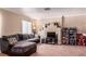 Inviting living room featuring a comfortable couch, neutral colors, and media storage at 8600 W Charleston Blvd # 2190, Las Vegas, NV 89117