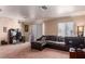 Comfortable living room with a large sectional sofa and natural light from sliding glass doors at 8600 W Charleston Blvd # 2190, Las Vegas, NV 89117
