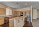 Kitchen featuring stainless steel appliances, breakfast bar, granite countertops and wood cabinetry at 8980 High Horizon Ave, Las Vegas, NV 89149