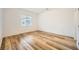 Bright bedroom with wood-style floors and window with blinds at 965 Nevada State Dr # 8202, Henderson, NV 89002