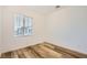 Bright bedroom with hardwood flooring, a window offering natural light and neutral walls at 965 Nevada State Dr # 8202, Henderson, NV 89002