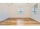 Bright bedroom with wood-style floors, window with blinds, and neutral decor at 965 Nevada State Dr # 8202, Henderson, NV 89002