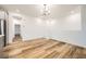 Bright dining room features recessed lights, chandelier, and wood-style floors at 965 Nevada State Dr # 8202, Henderson, NV 89002