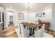 Open dining area with contemporary lighting, wooden table, and modern decor elements at 965 Nevada State Dr # 8202, Henderson, NV 89002