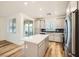 Bright kitchen features an island, stainless steel appliances, and sliding glass doors at 965 Nevada State Dr # 8202, Henderson, NV 89002
