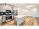Kitchen features an island, stainless steel appliances, and a view into the dining area at 965 Nevada State Dr # 8202, Henderson, NV 89002