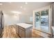 Kitchen features an island, stainless steel appliances, and sliding glass doors at 965 Nevada State Dr # 8202, Henderson, NV 89002