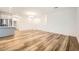 Open-concept living and dining area with hardwood floors and modern lighting at 965 Nevada State Dr # 8202, Henderson, NV 89002