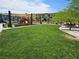 A neighborhood playground with slides, climbing structures, and benches for children to enjoy at 965 Nevada State Dr # 8202, Henderson, NV 89002