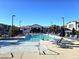 A large swimming pool with lounge chairs and umbrellas for residents' relaxation at 965 Nevada State Dr # 8202, Henderson, NV 89002