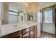 Bathroom featuring a double sink vanity, large mirror, and tile flooring at 971 Sable Chase Pl, Henderson, NV 89011