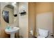 Half bathroom with a pedestal sink and toilet at 971 Sable Chase Pl, Henderson, NV 89011