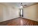 Bright bedroom featuring warm wood floors, a ceiling fan, and a window at 971 Sable Chase Pl, Henderson, NV 89011