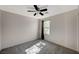 This simple bedroom has gray carpet and a black ceiling fan at 971 Sable Chase Pl, Henderson, NV 89011