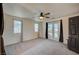 Bedroom featuring a ceiling fan, carpeted floors, and natural lighting at 971 Sable Chase Pl, Henderson, NV 89011