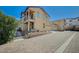 Charming home with a two-story exterior, balcony and a paved driveway on a sunny day at 971 Sable Chase Pl, Henderson, NV 89011