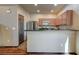 Kitchen featuring stainless steel appliances, breakfast bar, and granite countertops at 971 Sable Chase Pl, Henderson, NV 89011