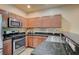 Kitchen showcases stainless steel appliances and granite countertops at 971 Sable Chase Pl, Henderson, NV 89011
