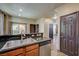 Well-equipped kitchen with granite countertops and a stainless steel dishwasher at 971 Sable Chase Pl, Henderson, NV 89011