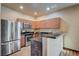 Bright kitchen with stainless steel appliances, including a refrigerator, oven, and microwave at 971 Sable Chase Pl, Henderson, NV 89011