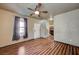 Cozy living area boasts wood flooring, a ceiling fan, and a staircase at 971 Sable Chase Pl, Henderson, NV 89011