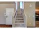Staircase leading to the upper level of the home with natural lighting at 971 Sable Chase Pl, Henderson, NV 89011