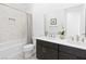 Modern bathroom with double vanity, stylish mirror, and bathtub with elegant marble tile at 9993 Skye Gazer Ave, Las Vegas, NV 89166