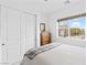 Bright bedroom featuring a plush bed, dresser, and large window view at 9993 Skye Gazer Ave, Las Vegas, NV 89166