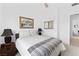 Comfortable bedroom featuring a plush bed, stylish side tables, and scenic artwork at 9993 Skye Gazer Ave, Las Vegas, NV 89166