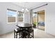 Bright breakfast nook with modern chandelier and sliding doors to a cozy outdoor patio at 9993 Skye Gazer Ave, Las Vegas, NV 89166