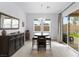 Cozy dining room with modern furniture and sliding door access to the backyard at 9993 Skye Gazer Ave, Las Vegas, NV 89166