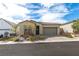 Charming single-story home with a two-car garage and low-maintenance desert landscaping at 9993 Skye Gazer Ave, Las Vegas, NV 89166