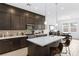 Modern kitchen with stainless steel appliances, center island, and ample cabinetry at 9993 Skye Gazer Ave, Las Vegas, NV 89166