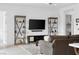 Bright living room featuring stylish shelving units and a modern entertainment center at 9993 Skye Gazer Ave, Las Vegas, NV 89166