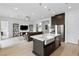 Open-concept kitchen and living area with modern appliances and fixtures at 9993 Skye Gazer Ave, Las Vegas, NV 89166