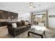 Open-concept living room and kitchen with access to a private backyard patio at 9993 Skye Gazer Ave, Las Vegas, NV 89166
