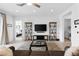 Open living area with tile floors, modern entertainment center and backyard views at 9993 Skye Gazer Ave, Las Vegas, NV 89166