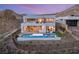 Contemporary multi-story home boasts a backyard pool, covered patio and hilltop views at 10 Sand Star Ln, Henderson, NV 89011