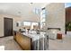 Kitchen island overlooking an open living room with a modern fireplace at 10 Sand Star Ln, Henderson, NV 89011