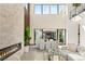 Open floor plan, with floor to ceiling windows and an open fireplace at 10 Sand Star Ln, Henderson, NV 89011