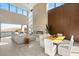 Expansive living area with fireplace and open dining room features abundant natural light and scenic views from oversized windows at 10 Sand Star Ln, Henderson, NV 89011