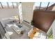 Aerial view of open concept living space, modern fireplace, and mountain views at 10 Sand Star Ln, Henderson, NV 89011