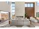 Spacious living room with floor-to-ceiling windows and a modern fireplace at 10 Sand Star Ln, Henderson, NV 89011