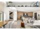 Modern, open living space with kitchen, dining, and staircase at 10 Sand Star Ln, Henderson, NV 89011