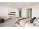 Bright main bedroom with a king bed, sitting area, and an ensuite bathroom with glass enclosed shower at 10 Sand Star Ln, Henderson, NV 89011