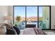 This main bedroom boasts a beautiful view of the outdoor pool and patio area at 10 Sand Star Ln, Henderson, NV 89011