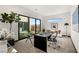 Modern office featuring a work space, art, and natural light from large windows at 10 Sand Star Ln, Henderson, NV 89011