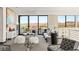 Spacious upstairs sitting area features mountain views, plush seating, and access to an outdoor balcony at 10 Sand Star Ln, Henderson, NV 89011